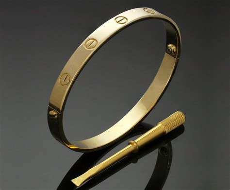 cartier love bracelet on hand.